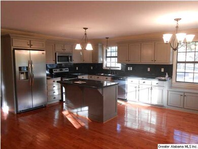 Kitchen with new cabinets, countertops, and applia