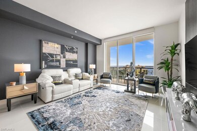 Living room with tile patterned floors and expansive windows