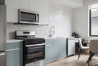 Kitchen with stainless steel appliances, a sink, 