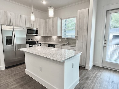 Kitchen with SS appliances, granite countertops, a