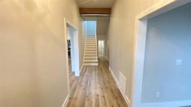 Hall with stairs, light wood-style floors, visible