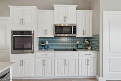 Kitchen featuring appliances with stainless steel