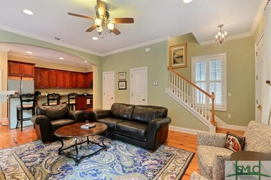 View from Living Room of Kitchen, banister and fro