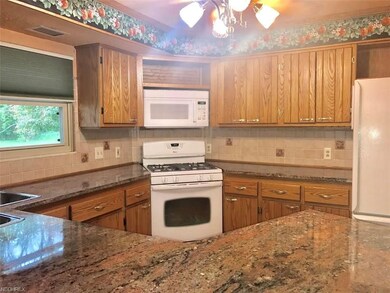 Updated kitchen with granite countertops and custo