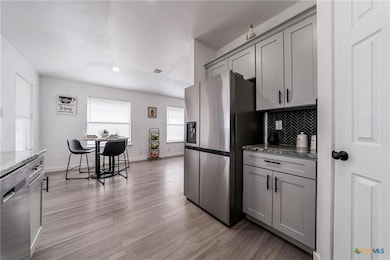 Kitchen with light stone countertops, decorative 