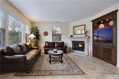 Adjoins the kitchen, a large family room with a fi