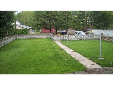 Land/Lot. Large level lot with a white picket fenc