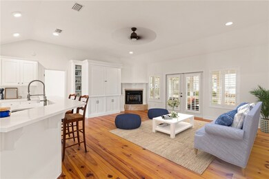 Living room with new fan, new paint, built in ente