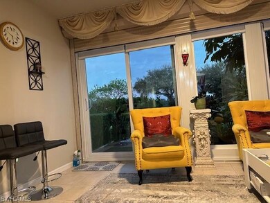 Sitting room featuring light tile patterned floori