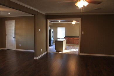 beautiful open 25x20 livingroom with new wood lami