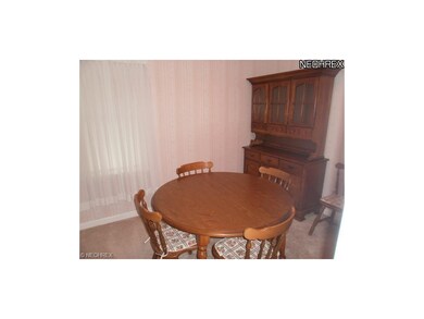 A bedroom is currently being utilized as a dinning