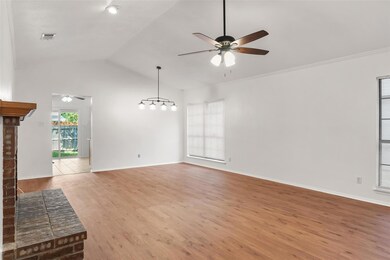 Unfurnished living room with ceiling fan, vaulted 