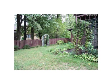 Back yard with trellis to bridge over the creek.