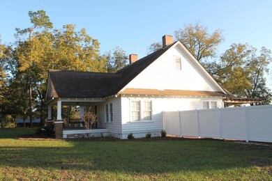 Side with fence around pool area