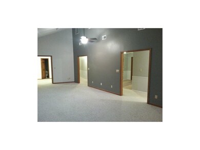 Living room looking toward office/den and 1/2 bath