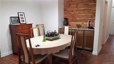 Dining area has lots of rustic charm with a built-