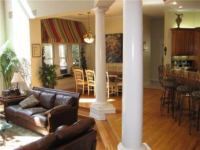 The open floor plan, beautiful hardwood, vaulted c