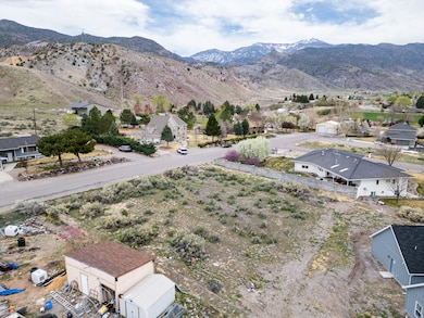 Aerial perspective of rural area featuring a mountainous background