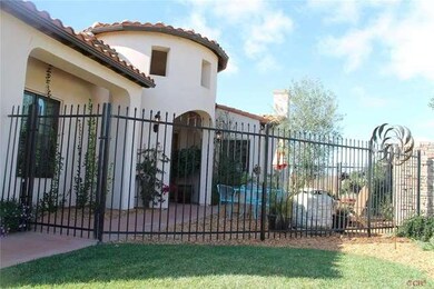 Fenced front court yard with large and inviting en
