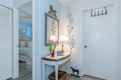Step into the foyer with the laundry room just to 