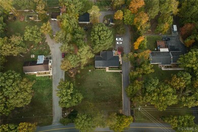 Aerial of great lot with paved drive and detached
