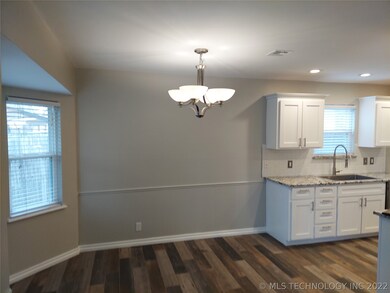 Three bay window dining area with new wood looking