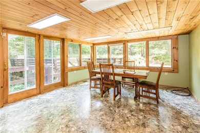 Beautiful bright dining room with patio door to de