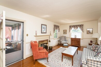 A view of the living room with door to the enclose