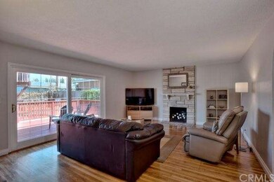 Living room with large slider to the deck and back