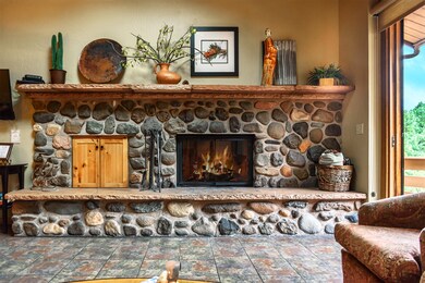 Hand Hewn River Rock Fireplace