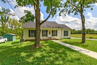 Concrete pathway leading to the home and patio makes for a very inviting feel! 