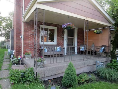 Exterior Front. Enjoy relaxing on the large covere
