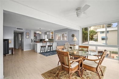 Dining space featuring ceiling fan and baseboards