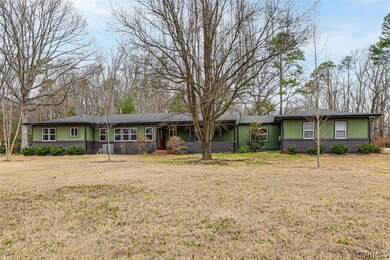 Resting on an idyllic 1.78 acre lot in Bon Air's b