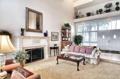 ...to a grand foyer with soaring vaulted ceilings,