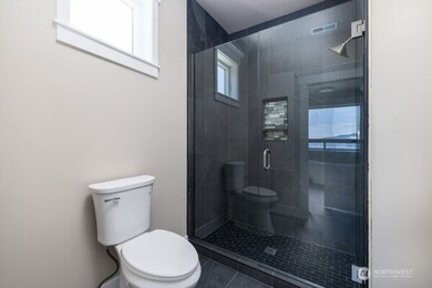 tiled shower in Primary Bath