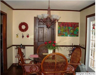 Eating area in kitchen is spacious with a nice cha
