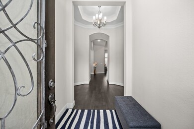 As you step inside this elegant home, you're greet