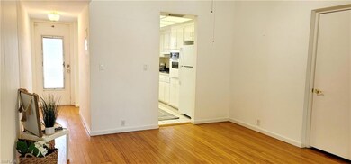 Hall with light hardwood / wood-style floors