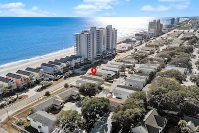 Aerial view featuring a water view and a view of t
