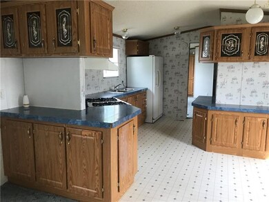 Kitchen with lots of cupboards and countertops.