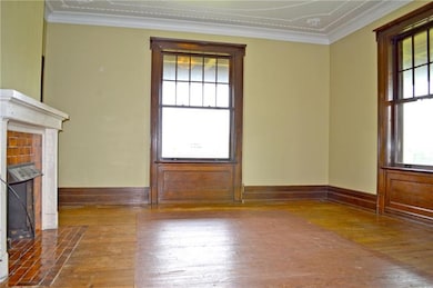 Gentleman's Lounge with Hardwood Floors, Brick Hea