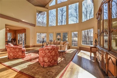 Lovely wooded winter view in 2-store great room.