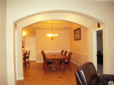 Dining Room. Beautiful designer arches enhance thi