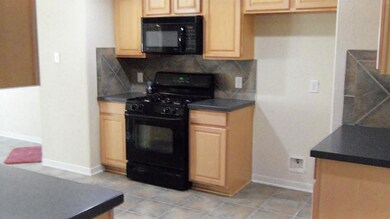 Kitchen with Corian Counter top and Back Builtin a