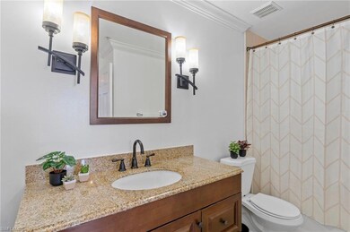 Bathroom with vanity and curtained shower