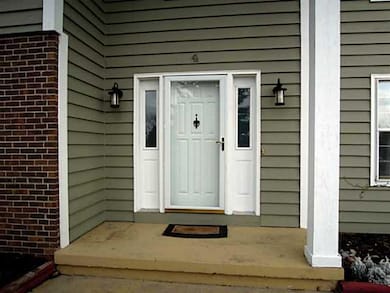 Exterior Front. Freshly stained exterior with whit