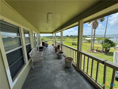 upstairs porch with view of canal and bay