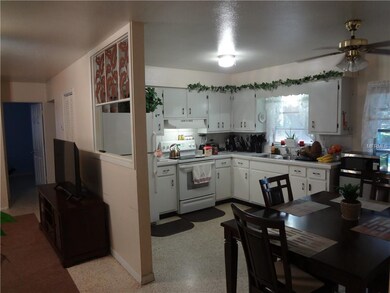 Open living - dining area looking into kitchen