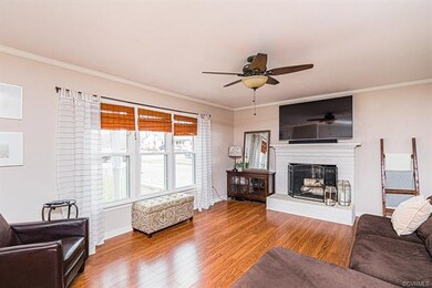 FAMILY ROOM W/ HW FLOORS, CEILING FAN, CROWN, FIRE